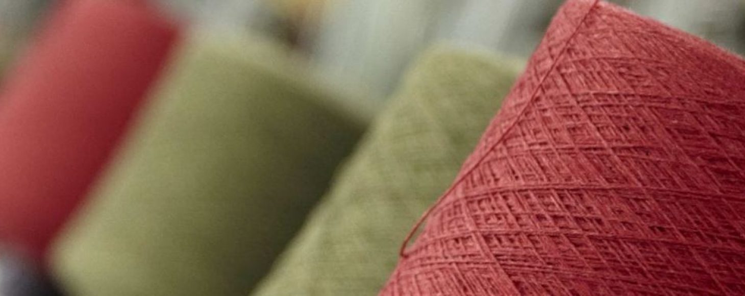 A collection of yarn spools shown in close up detail